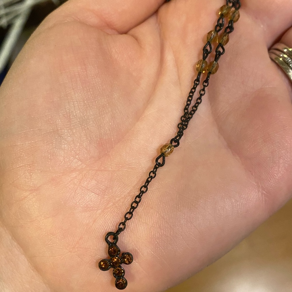 Black necklace with amber rhinestone cross